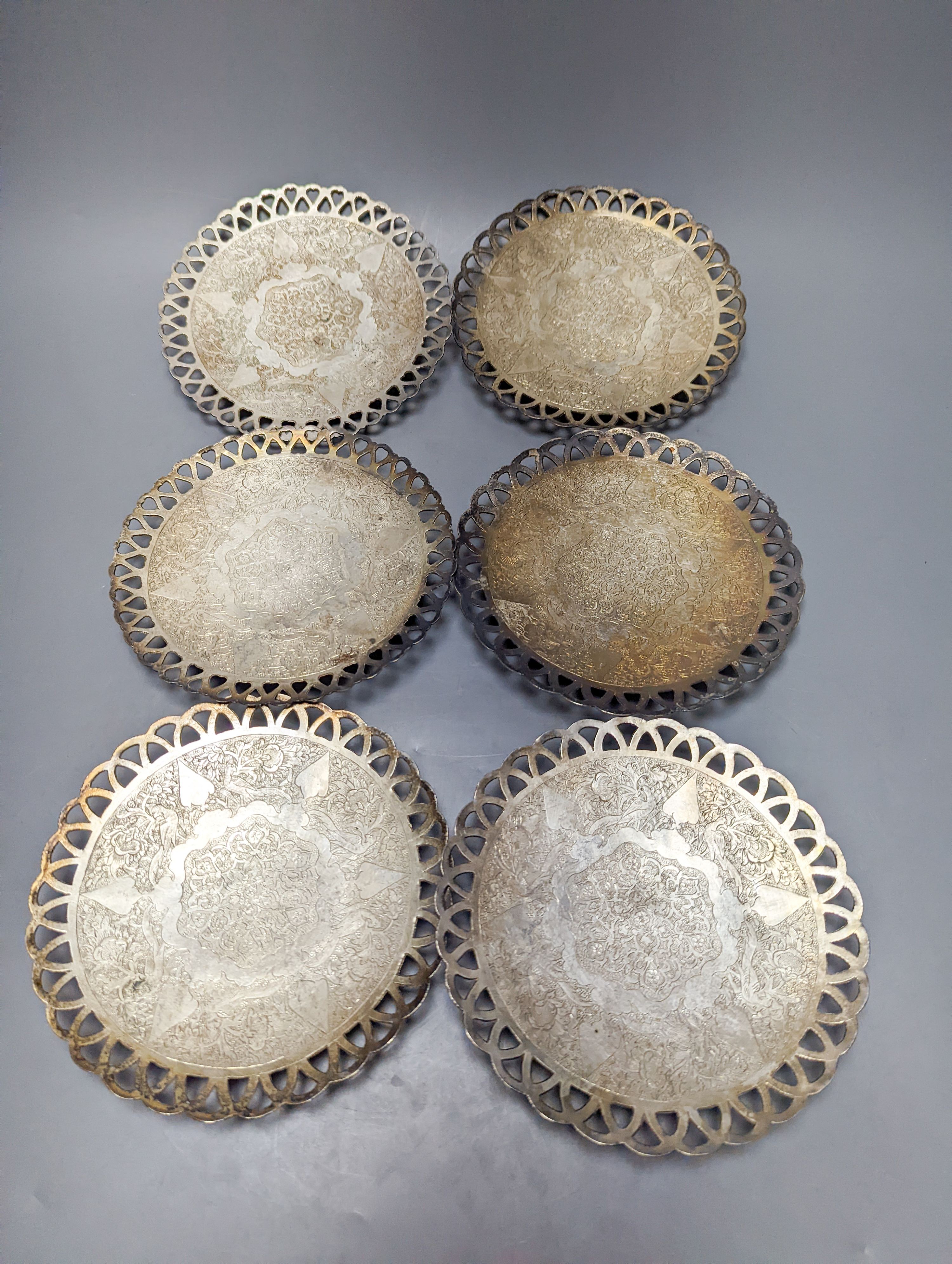 A set of six Persian white metal circular shallow dishes, with pierced borders, 16.3cm, 972 grams.